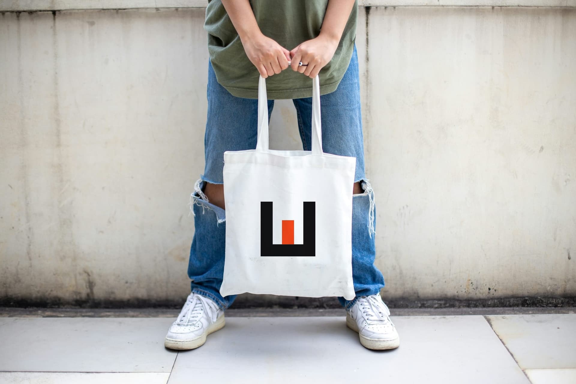 A tote printed with the Epic Wolf mark